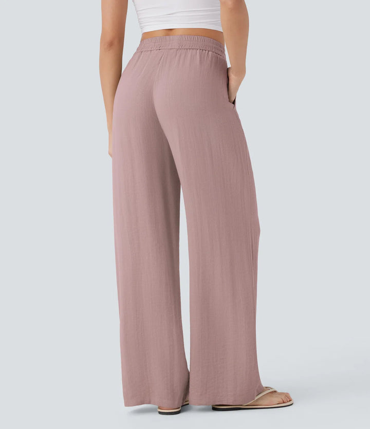 Pantalon large fluide taille haute avec cordon de serrage, poches latérales et aspect lin