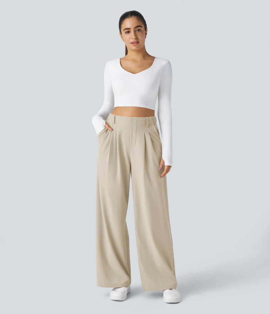Pantalon fluide à taille haute et jambes larges, en tissu gaufré, avec poches latérales