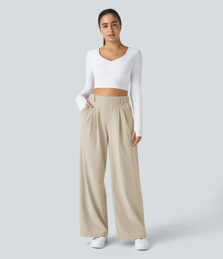 Pantalon fluide à taille haute et jambes larges, en tissu gaufré, avec poches latérales