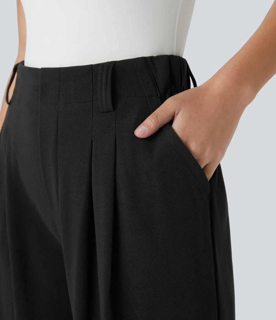 Pantalon fluide à taille haute et jambes larges, en tissu gaufré, avec poches latérales