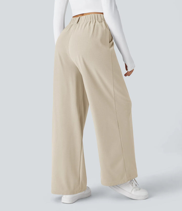 Pantalon fluide à taille haute et jambes larges, en tissu gaufré, avec poches latérales