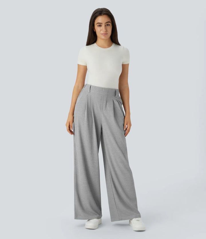 Pantalon fluide à taille haute et jambes larges, en tissu gaufré, avec poches latérales