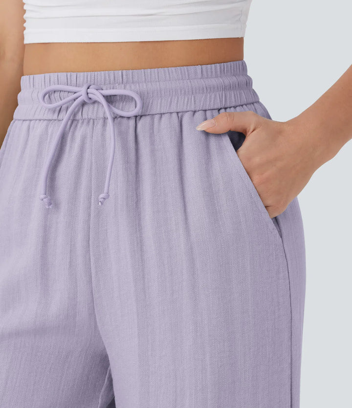 Pantalon large fluide taille haute avec cordon de serrage, poches latérales et aspect lin