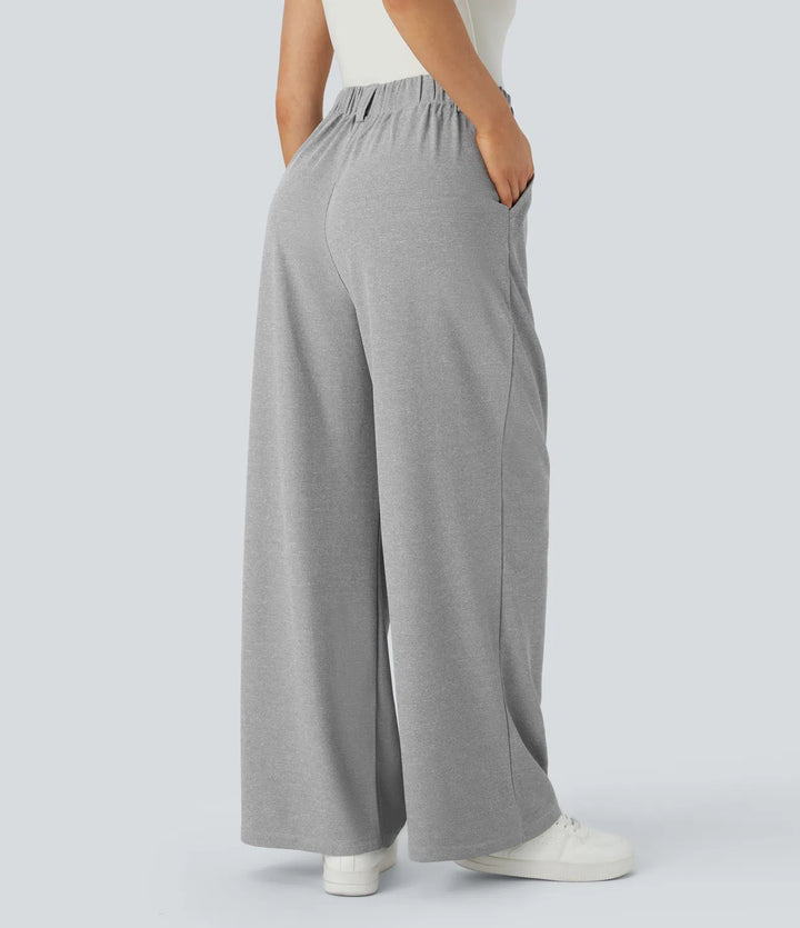 Pantalon fluide à taille haute et jambes larges, en tissu gaufré, avec poches latérales