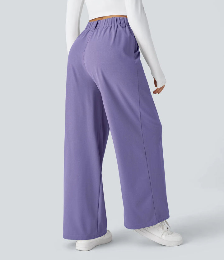 Pantalon fluide à taille haute et jambes larges, en tissu gaufré, avec poches latérales