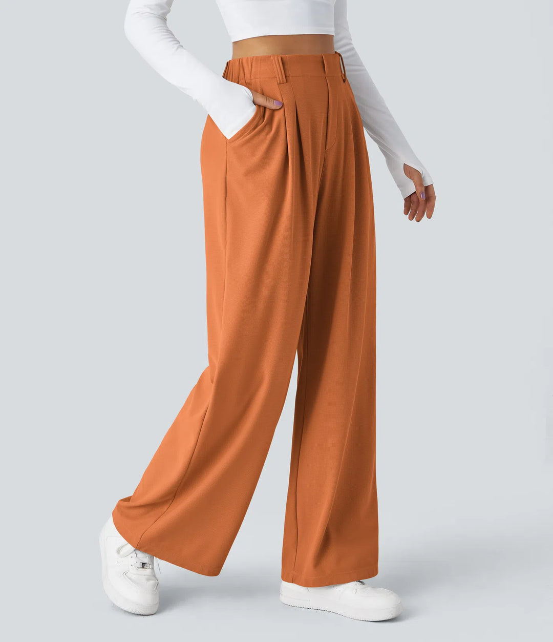 Pantalon fluide à taille haute et jambes larges, en tissu gaufré, avec poches latérales