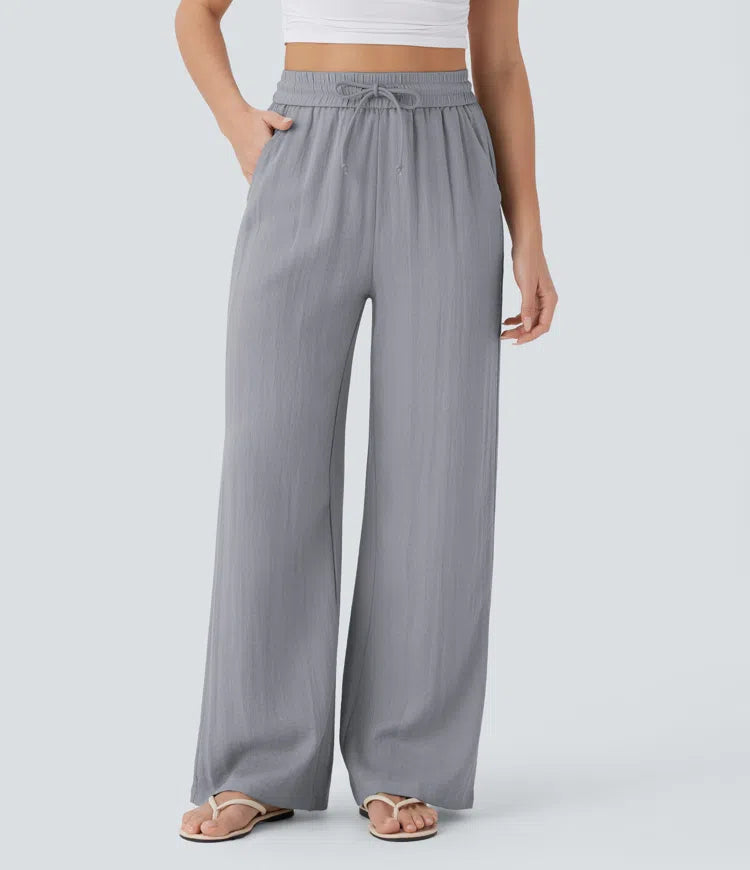 Pantalon large fluide taille haute avec cordon de serrage, poches latérales et aspect lin