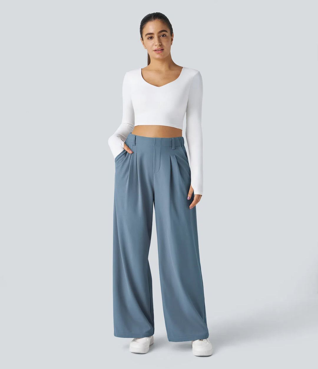 Pantalon fluide à taille haute et jambes larges, en tissu gaufré, avec poches latérales