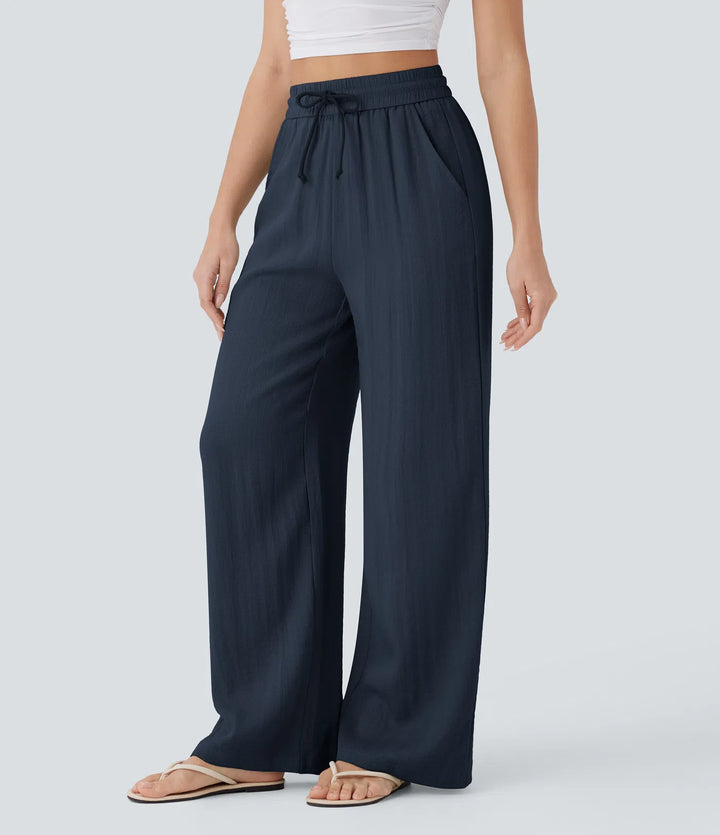 Pantalon large fluide taille haute avec cordon de serrage, poches latérales et aspect lin