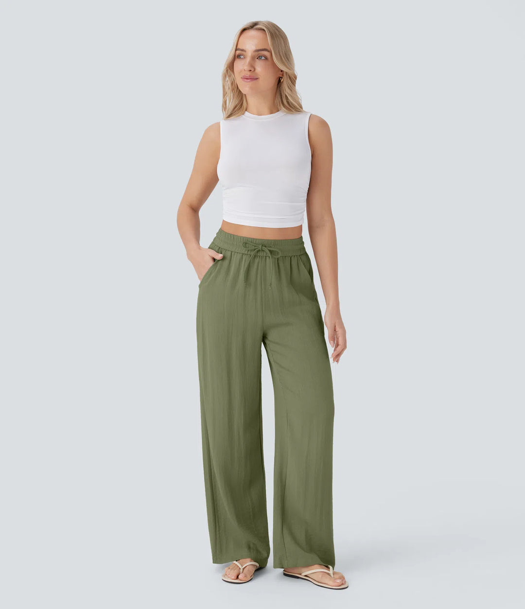 Pantalon large fluide taille haute avec cordon de serrage, poches latérales et aspect lin