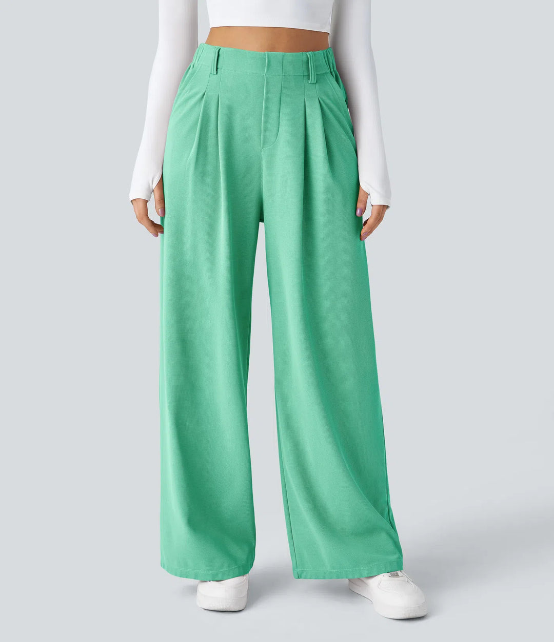 Pantalon fluide à taille haute et jambes larges, en tissu gaufré, avec poches latérales