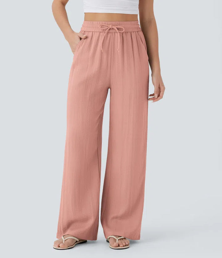 Pantalon large fluide taille haute avec cordon de serrage, poches latérales et aspect lin