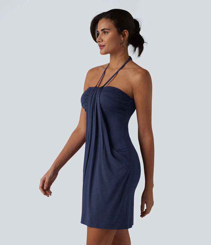 Robe resort mini dos nu à col licou avec lien noué dans le dos et poches