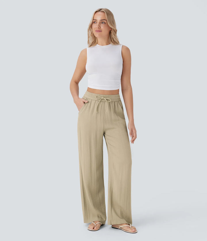 Pantalon large fluide taille haute avec cordon de serrage, poches latérales et aspect lin