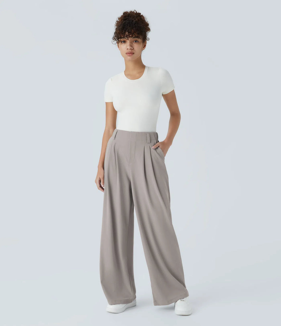 Pantalon fluide à taille haute et jambes larges, en tissu gaufré, avec poches latérales