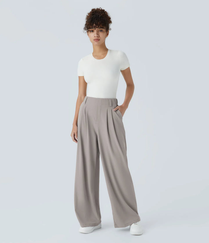 Pantalon fluide à taille haute et jambes larges, en tissu gaufré, avec poches latérales