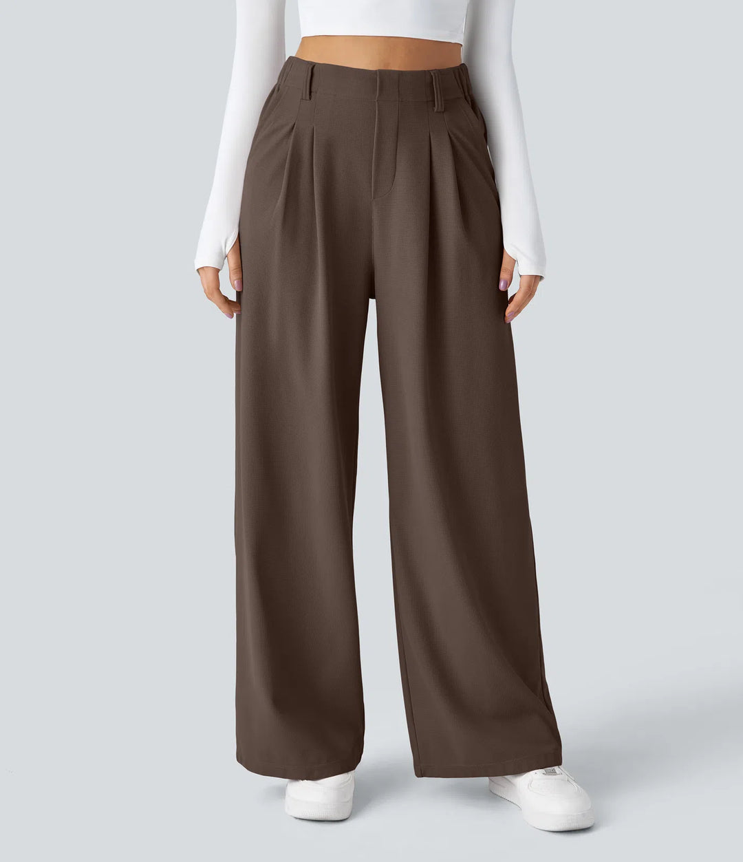 Pantalon fluide à taille haute et jambes larges, en tissu gaufré, avec poches latérales