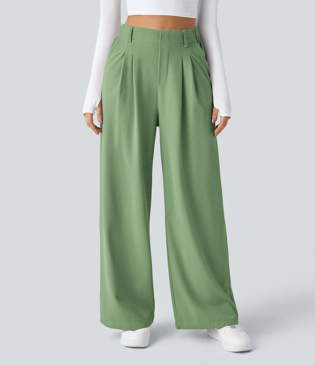 Pantalon fluide à taille haute et jambes larges, en tissu gaufré, avec poches latérales