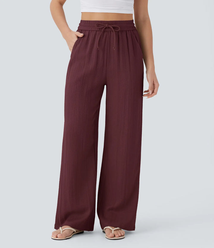 Pantalon large fluide taille haute avec cordon de serrage, poches latérales et aspect lin