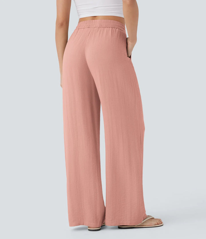 Pantalon large fluide taille haute avec cordon de serrage, poches latérales et aspect lin