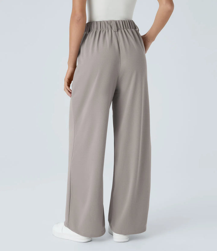 Pantalon fluide à taille haute et jambes larges, en tissu gaufré, avec poches latérales
