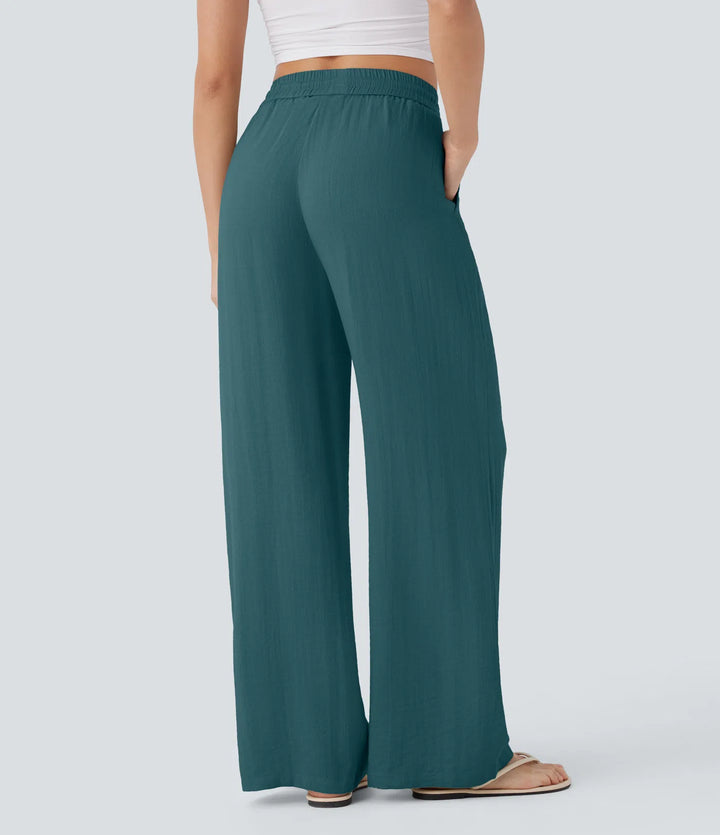 Pantalon large fluide taille haute avec cordon de serrage, poches latérales et aspect lin