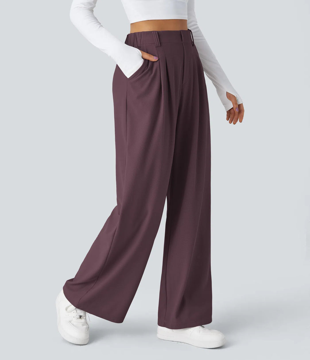 Pantalon fluide à taille haute et jambes larges, en tissu gaufré, avec poches latérales