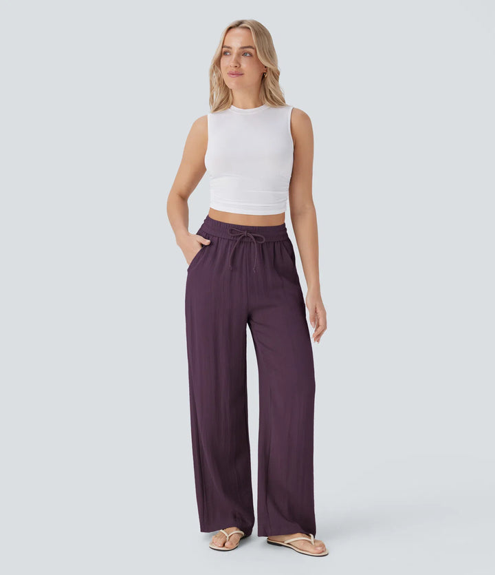Pantalon large fluide taille haute avec cordon de serrage, poches latérales et aspect lin