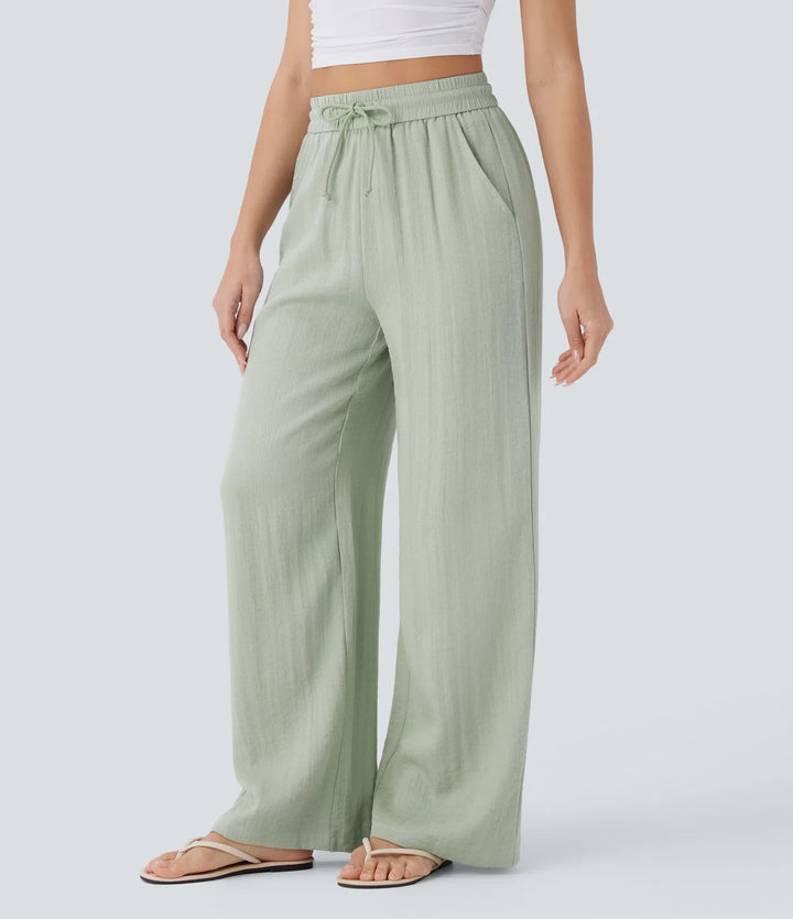Pantalon large fluide taille haute avec cordon de serrage, poches latérales et aspect lin