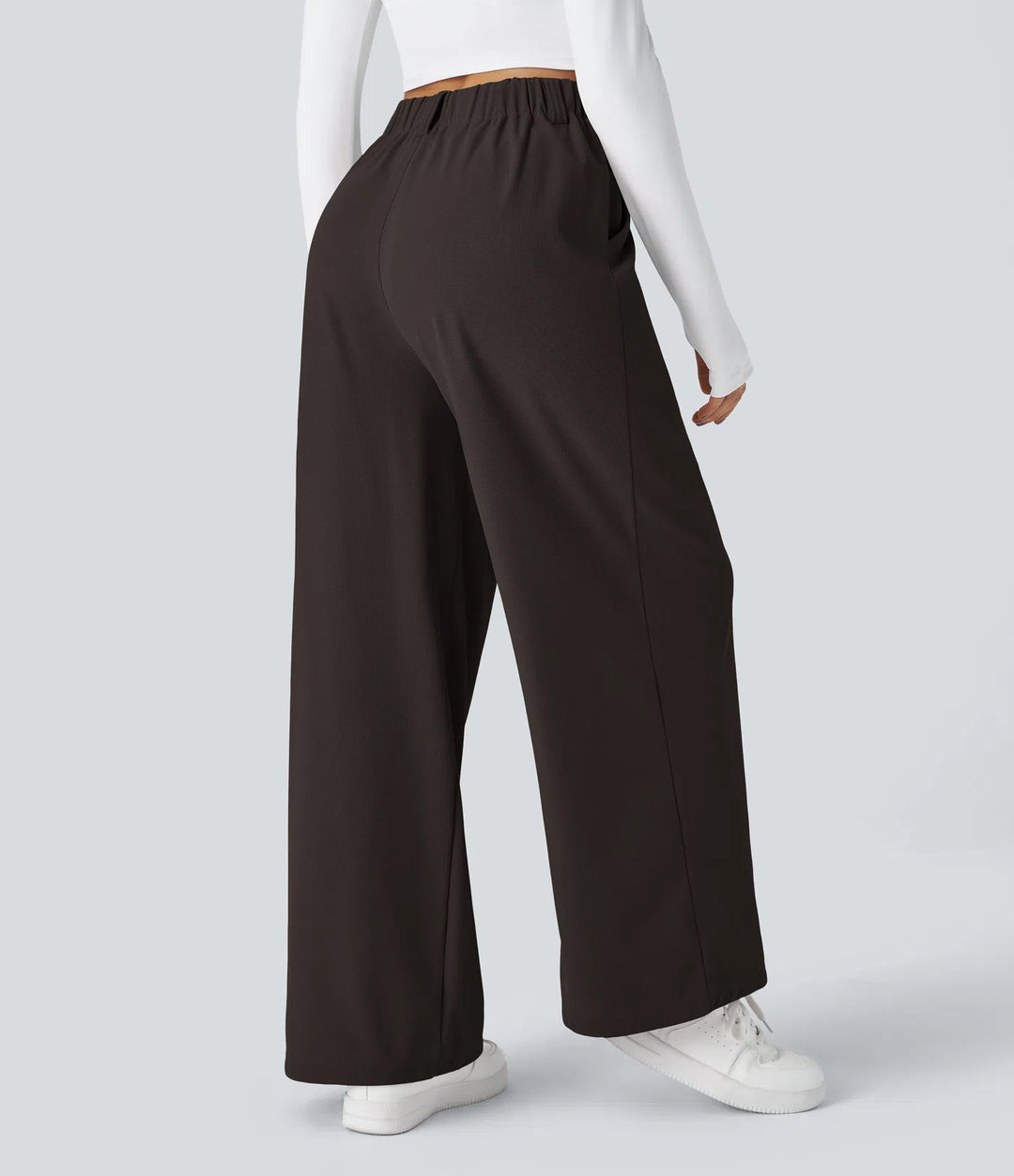 Pantalon fluide à taille haute et jambes larges, en tissu gaufré, avec poches latérales