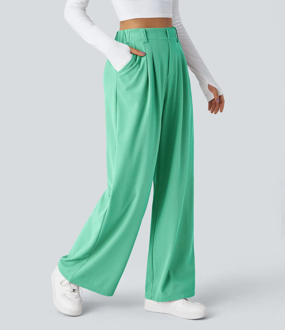 Pantalon fluide à taille haute et jambes larges, en tissu gaufré, avec poches latérales