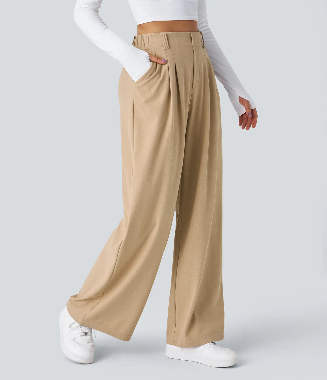 Pantalon fluide à taille haute et jambes larges, en tissu gaufré, avec poches latérales