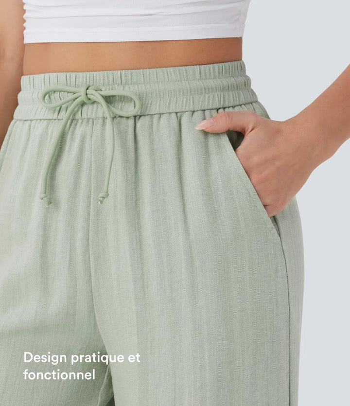 Pantalon large fluide taille haute avec cordon de serrage, poches latérales et aspect lin
