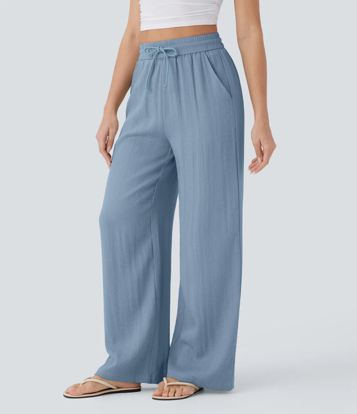 Pantalon large fluide taille haute avec cordon de serrage, poches latérales et aspect lin