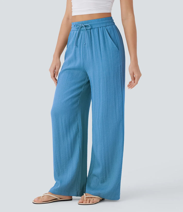 Pantalon large fluide taille haute avec cordon de serrage, poches latérales et aspect lin