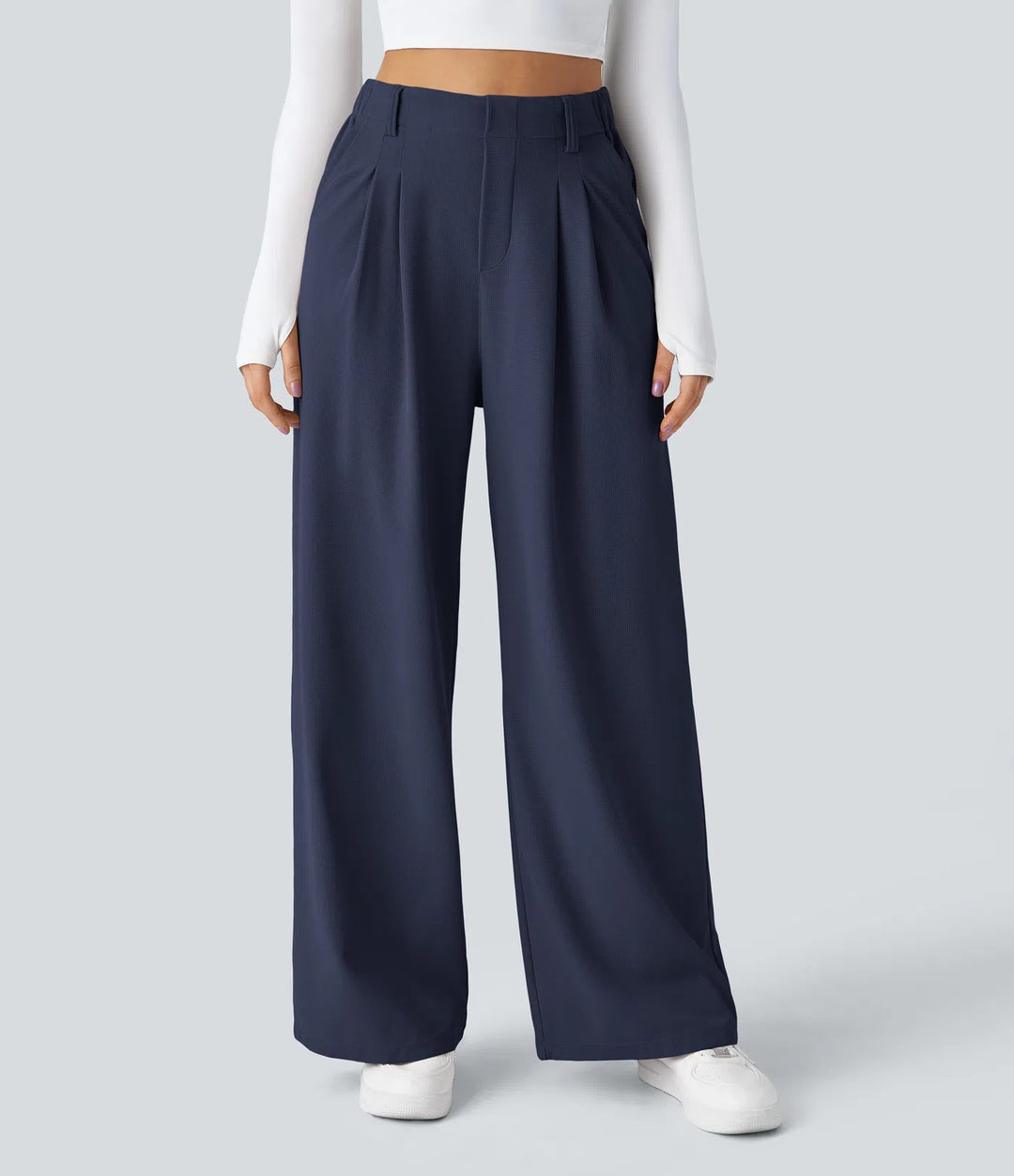 Pantalon fluide à taille haute et jambes larges, en tissu gaufré, avec poches latérales