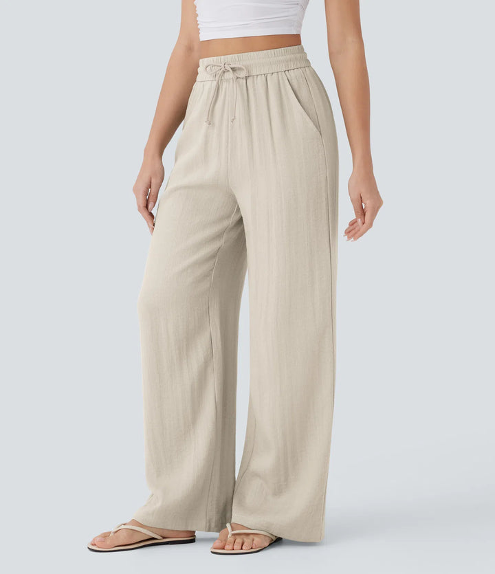 Pantalon large fluide taille haute avec cordon de serrage, poches latérales et aspect lin