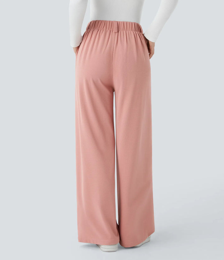 Pantalon fluide à taille haute et jambes larges, en tissu gaufré, avec poches latérales