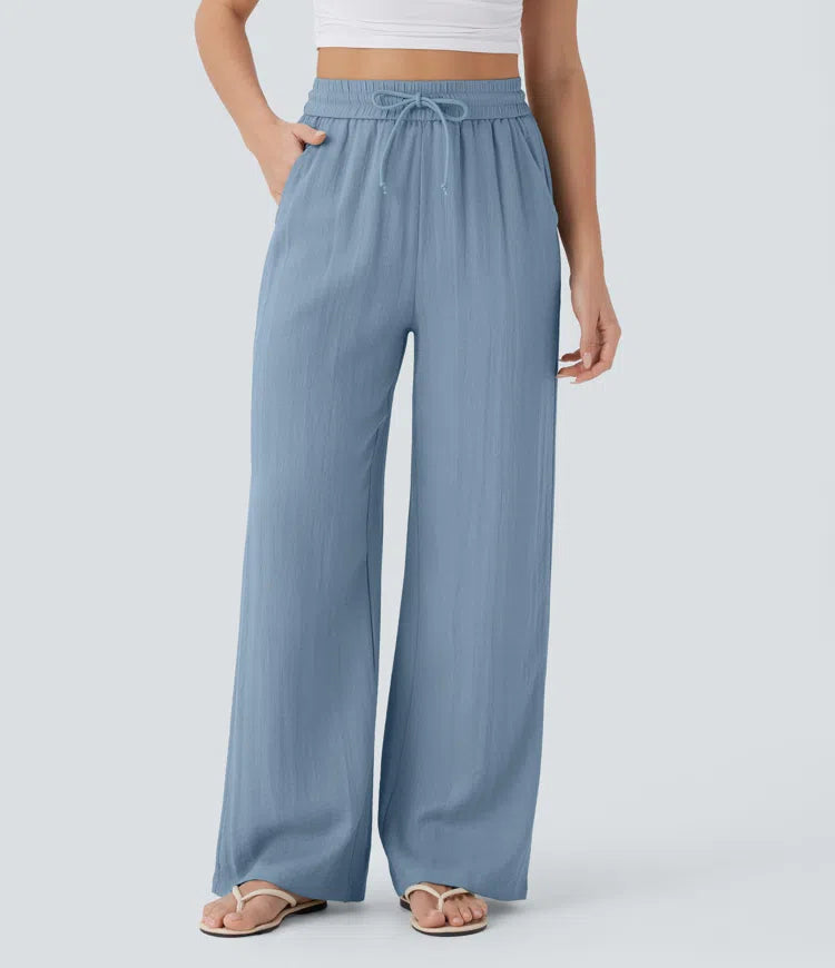 Pantalon large fluide taille haute avec cordon de serrage, poches latérales et aspect lin