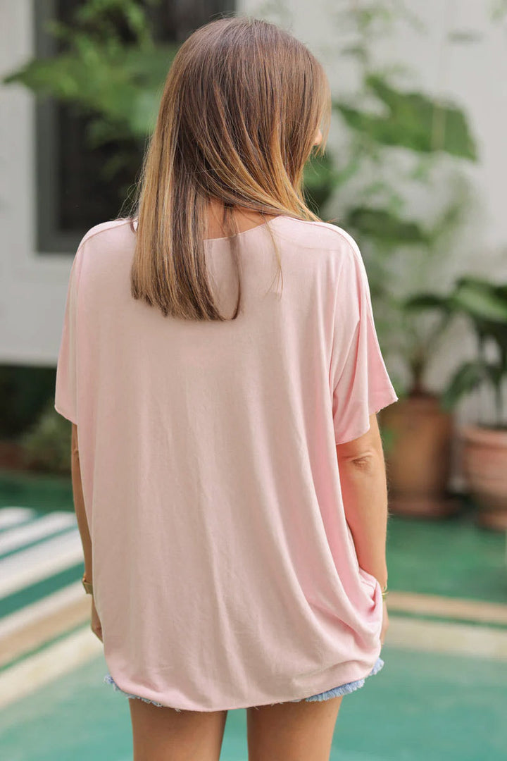 Top rose pâle fluide confort et stretch col v